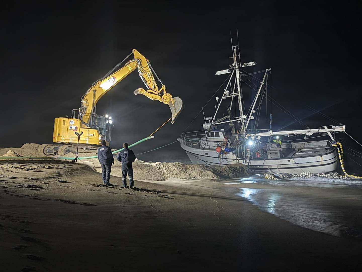 U.S. Coast Guard personnel monitor response operations for the aground fishing vessel Lake Bay on Point Reyes North Beach, California, August 23, 2026. The Lake Bay was reported to have approximately 1400 gallons of diesel fuel, 150 gallons of hydraulic oil, and 30-50 tons of squid catch onboard. (U.S. Coast Guard courtesy photo)