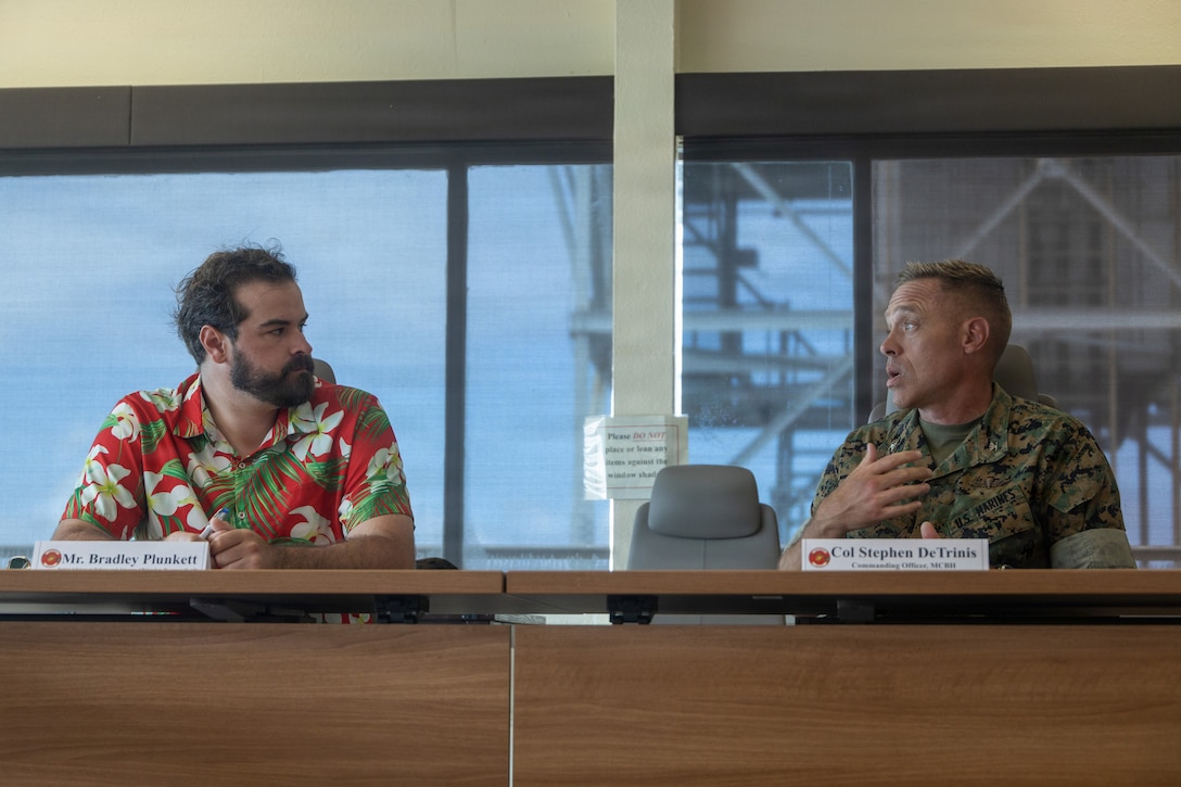 Mr. Bradley Plunkett, left, the Senior Defense and Veterans Affairs Advisor for Senator John Boozman, speaks to U.S. Marine Corps Col. Stephen DeTrinis, commanding officer of Marine Corps Base Hawaii during a visit at MCBH, Aug. 13, 2026. This brief demonstrated MCBH’s role as a critical Indo-Pacific operational and logistics hub while strengthening congressional understanding of the sustained resources required to support the installation’s mission and execute oversight on current military construction projects and programs. (U.S. Marine Corps photo by Lance Cpl. Nicholas Figueroa)
