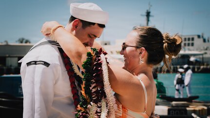 JOINT BASE PEARL HARBOR-HICKAM, Hawaii (August 27, 2026) - A Sailor assigned to Virginia-class fast-attack submarine USS Montana (SSN 794), greets his family as Montana returns to Joint Base Pearl Harbor-Hickam from deployment, August 27, 2026. Montana is assigned to Submarine Squadron 1 and is capable of supporting various missions, including anti-submarine warfare, anti-surface ship warfare, strike warfare, and intelligence, surveillance, and reconnaissance (U.S. Navy photo by Mass Communication Specialist 2nd Class Nicholas Russell).