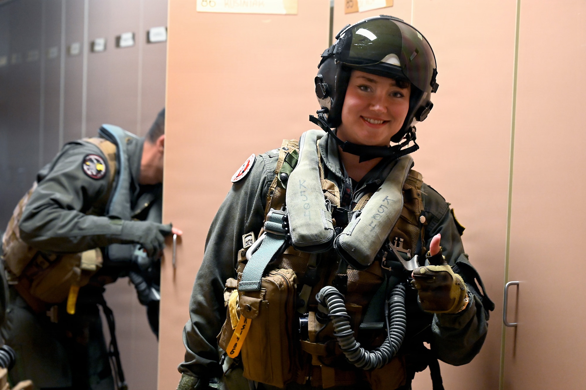 U.S. Navy Lt. Riley Savering, Electronic Attack Squadron 134 EA-18G Growler pilot, dons flight equipment during RED FLAG-Alaska 26-3 at Eielson Air Force Base, Alaska, Aug. 25, 2026.