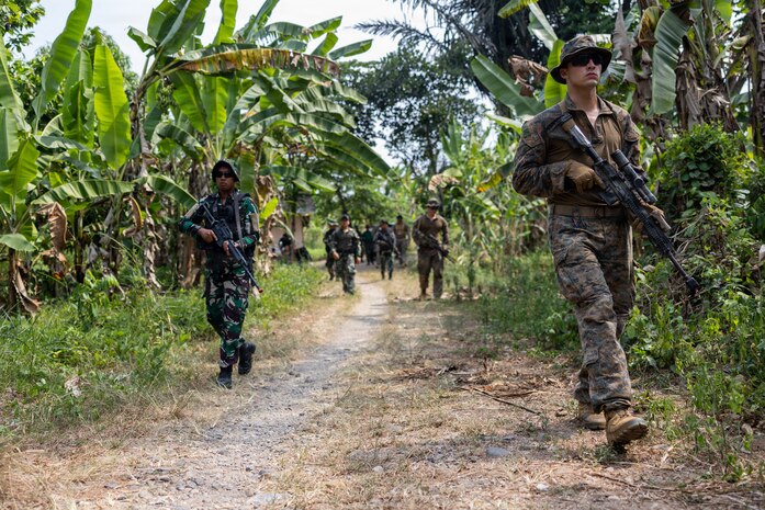 U.S. Marines with Alpha Company, 1st Battalion, 5th Marine Regiment, Marine Rotational Force – Darwin 26, and Indonesian marines with 7th Infantry Battalion, 4th Brigade, patrols during a jungle survival course as part of a platoon exchange near Lampung, Indonesia, Aug. 19, 2026.