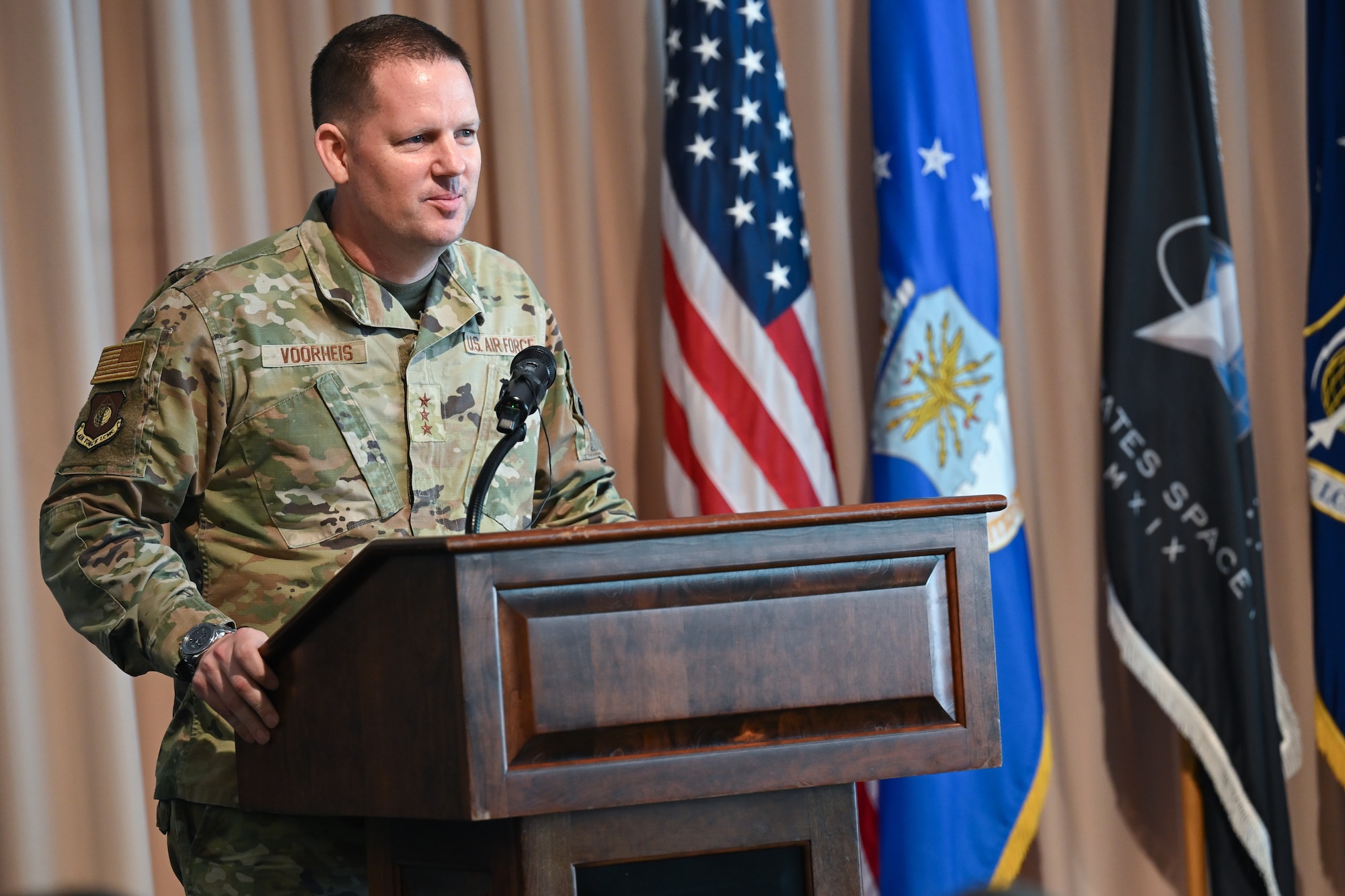 Lt. Gen. Jason Voorheis, commander of Air Force Life Cycle Management Center, speaks during the change of leadership ceremony, here, Aug. 28. Brig. Gen. Joshua Williams officially assumed leadership of the Department of the Air Force Portfolio Acquisition Executive for Command, Control, Communications and Battle Management on July. 31, 2026. The PAE integrates the C3BM materiel enterprise within the department, aligning technical architecture and acquisition authorities to streamline the delivery of decision advantage capabilities via the DAF Battle Network. (Official Air Force Photo by Richard Blumenstein).