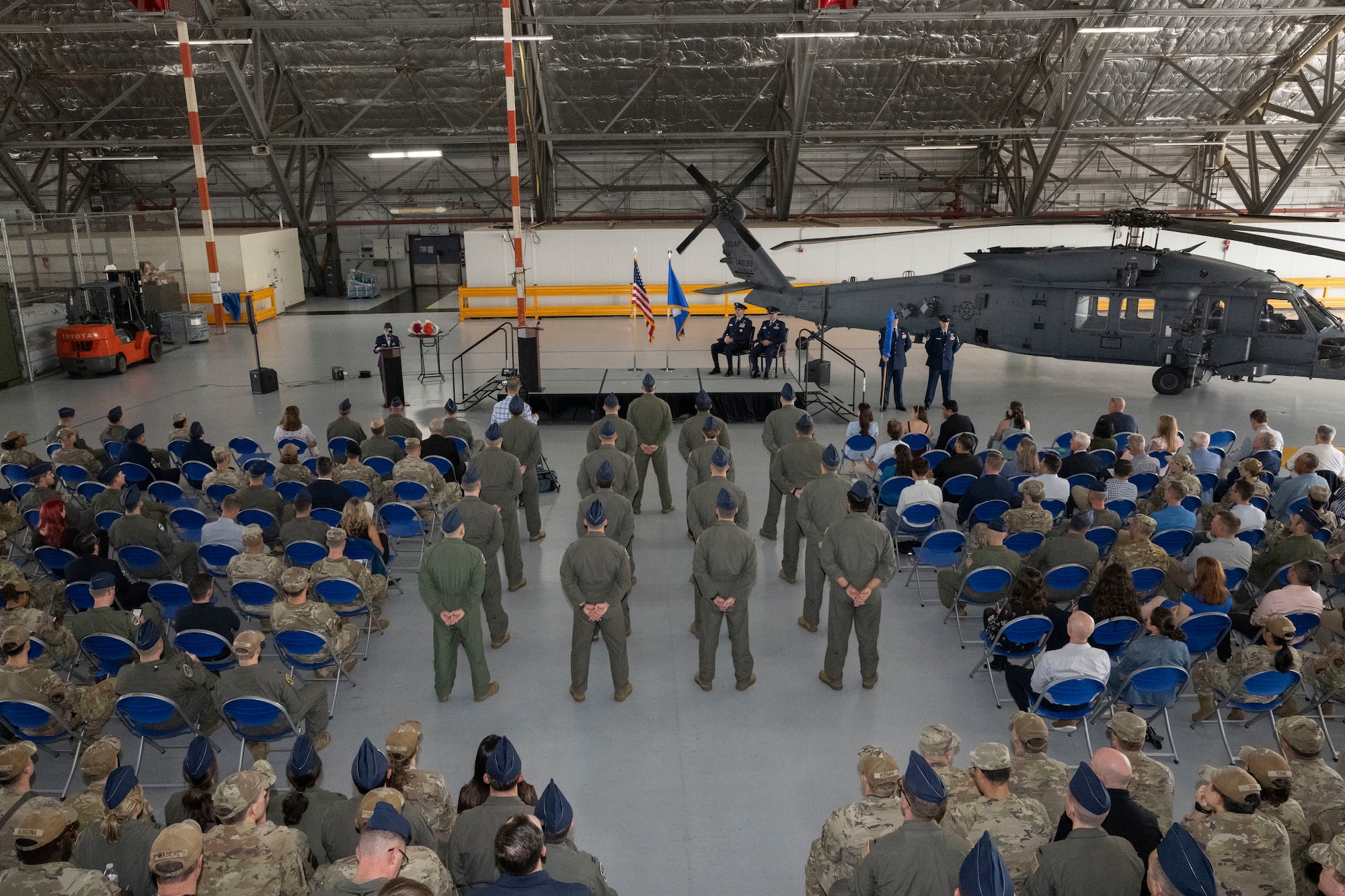 U.S. Air Force Airmen assigned to the 1st Helicopter Squadron stand in formation during the 5th Helicopter Squadron activation ceremony at Joint Base Andrews, Maryland, Aug. 27, 2026. Airmen in the formation were re-patched to signify the activation of the 5 HS that now stands alongside the 1 HS. (U.S. Air Force photo by Airman 1st Class Mauricio Hidalgo)