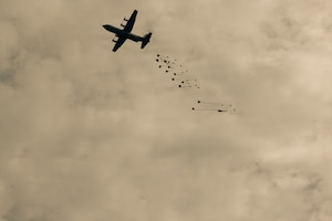A military transport aircraft drops supplies during exercise Saber Junction 26 at the Joint Multinational Readiness Center's Hohenfels Training Area, Germany, Aug. 24, 2026. The 7th Army Training Command provides a unique environment in Europe to develop leaders and formations prepared for large-scale combat operations, improving readiness. (U.S. Army photo by Spc. Aubrey Boyle, JMRC Vipers)