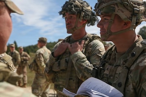 U.S. Soldiers assigned to the 173rd Mobile Brigade Combat Team (Airborne), prepare for an airdrop during exercise Saber Junction 26 at the Joint Multinational Readiness Center's Hohenfels Training Area, Germany, Aug. 24, 2026. Saber Junction 26 is an annual exercise for U.S. Army Europe and Africa's permanently assigned brigades and participating Allies and partners. (U.S. Army photo by Sgt. 1st Class Seth Plagenza)