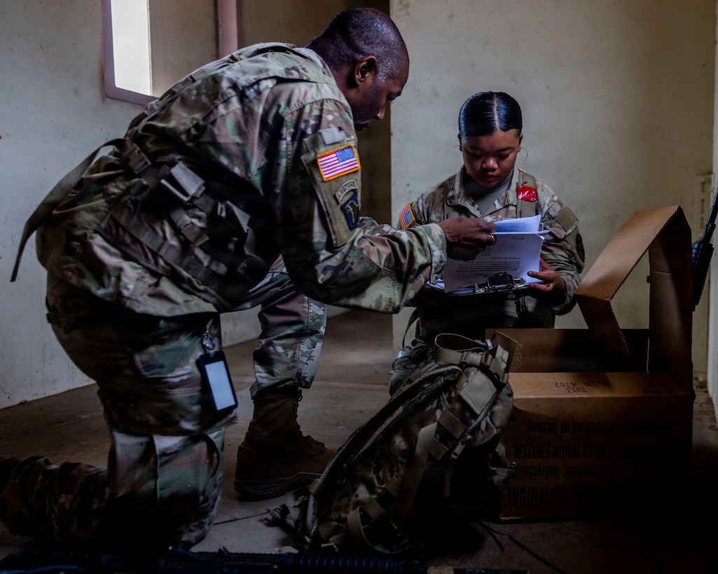 U.S. Army Staff Sgt. Rodney Smith, left, a veterinary food inspection specialist, and Spc. Alyssa Sim, a veterinary food inspection specialist, both with Veterinary Readiness Activity – San Diego, inspect Meals, Ready-to-Eat for quality assurance during a field training exercise at Marine Corps Base Camp Pendleton, California, Aug. 13, 2026. The training exercise was designed to increase technical knowledge, acclimate personnel to austere combat environments and refine fundamental skills such as close-quarters battle and Tactical Combat Casualty Care. (U.S. Marine Corps photo by Lance Cpl. Jonathan Sherchand)