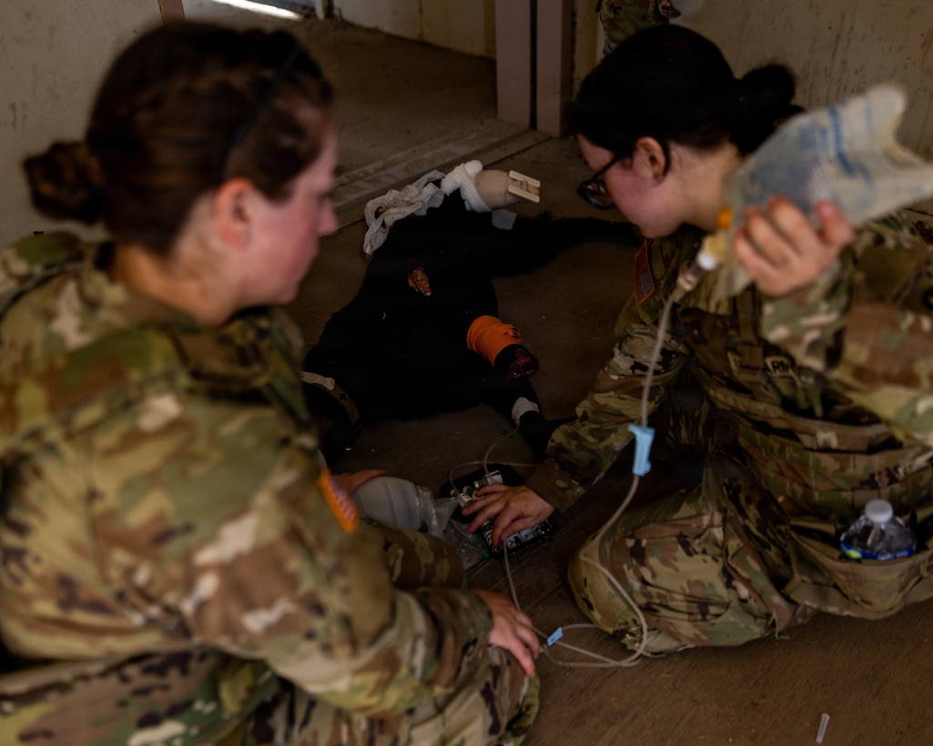 U.S. Army Soldiers with Veterinary Readiness Activity – San Diego, perform Tactical Combat Casualty Care on a K-9 simulator during a field training exercise at Marine Corps Base Camp Pendleton, California, Aug. 13, 2026. The training exercise was designed to increase technical knowledge, acclimate personnel to austere combat environments and refine fundamental skills such as close-quarters battle and TCCC. (U.S. Marine Corps photo by Lance Cpl. Jonathan Sherchand)
