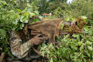 A U.S. Soldier assigned to Joint Multinational Readiness Center's Cherokee Company, 1st Battalion, 4th Infantry Regiment, pulls security during Saber Junction 26 at the Joint Multinational Readiness Center’s Hohenfels Training Area, Germany, Aug. 26, 2026. 7th Army Training Command provides a unique environment in Europe to develop leaders and formations who are prepared for large-scale combat operations, improving readiness.  (U.S. Army photo by Sgt. Collin Mackall)