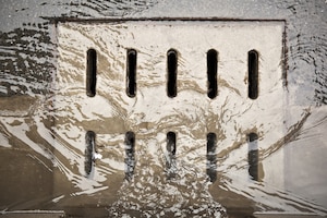 Photo shows water draining in a stormwater drain