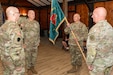 U.S. Army Maj. Gen. Michael E. Wegscheider, Pennsylvania National Guard Deputy Adjutant General-Army, passes the organizational colors to U.S. Army National Guard Lt. Col. Robert M. Cuthie during a change-of-command ceremony at Fort Indiantown Gap, Pennsylvania, Aug. 29. Cuthie assumed command of the Fort Indiantown Gap National Guard Training Center from U.S. Army National Guard Col. Kevin D. Potts during the ceremony. (Pennsylvania National Guard photo by Wayne V. Hall)