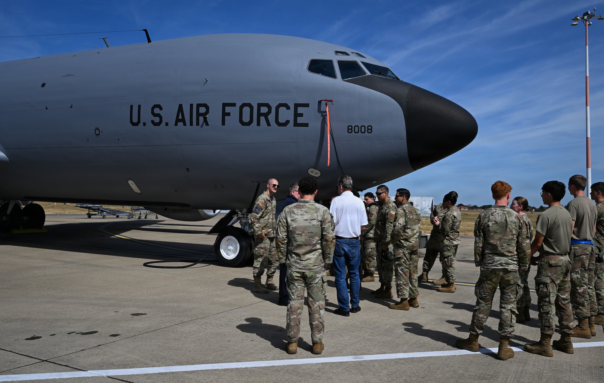 U.S. Airmen assigned to the 100th Aircraft Maintenance Squadron gather around a KC-135 Stratotanker for a wireless communication demonstration between ground personnel at RAF Mildenhall, England, Aug. 14, 2026.