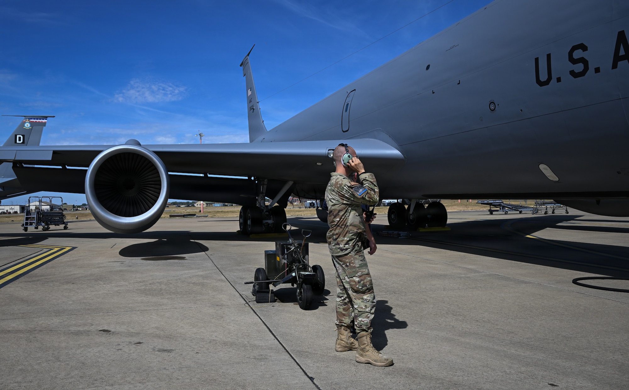 U.S. Air Force Tech. Sgt. Justin Gault, 100th Aircraft Maintenance Squadron noncommissioned officer in charge, tests the wireless communications capability on a KC-135 Stratotanker at RAF Mildenhall, England, Aug. 14, 2026.