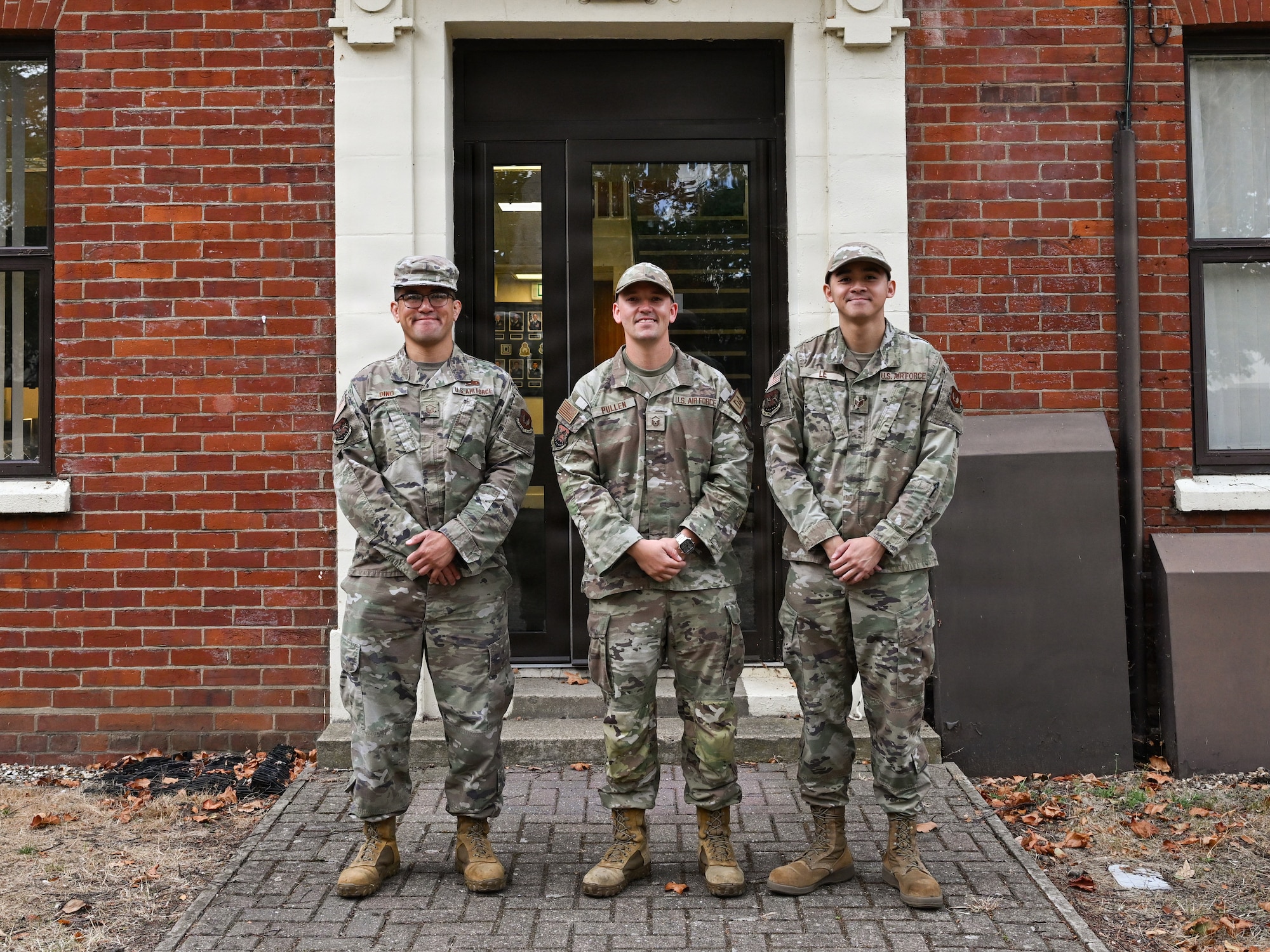 From left, U.S. Air Force Master Sgt. Eric Dino, 100th Air Refueling Wing Professional Development Center and Foundations noncommissioned officer in charge, Master Sgt. Eric Pullen, 100th ARW development advisor, and Staff Sgt. Ming Le, 100th ARW First Term Enlisted Course NCOIC pose for at RAF Mildenhall, Aug. 26, 2026.