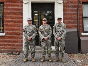 From left, U.S. Air Force Master Sgt. Eric Dino, 100th Air Refueling Wing Professional Development Center and Foundations noncommissioned officer in charge, Master Sgt. Eric Pullen, 100th ARW development advisor, and Staff Sgt. Ming Le, 100th ARW First Term Enlisted Course NCOIC pose for at RAF Mildenhall, Aug. 26, 2026.