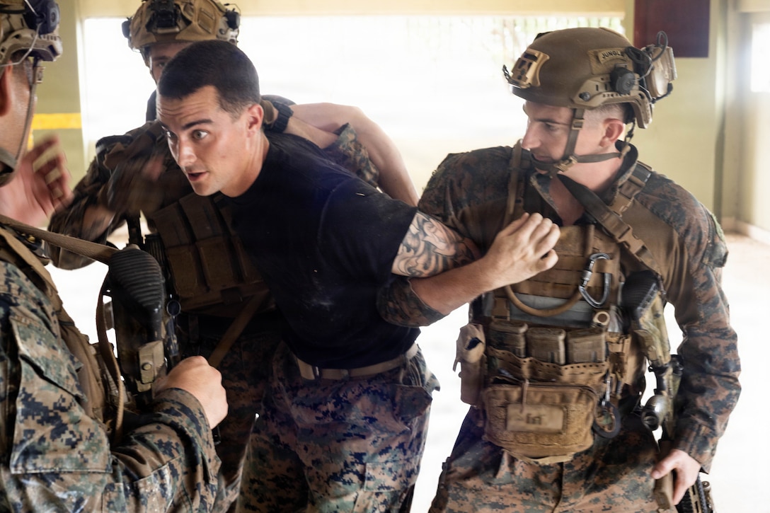U.S. Marines with 3rd Battalion, 2nd Marine Regiment, Littoral Combat Force-24, detain a simulated adversary member during a simulated raid in Colón, Panama, Aug. 21, 2026. U.S. military forces are deployed to the U.S. Southern Command area of responsibility in support of Joint Task Force Western Hemisphere, Department of War-directed operations, and the President's priorities to disrupt illicit drug trafficking, deter malign actors and protect the homeland through continuous presence. (U.S. Marine Corps photo)