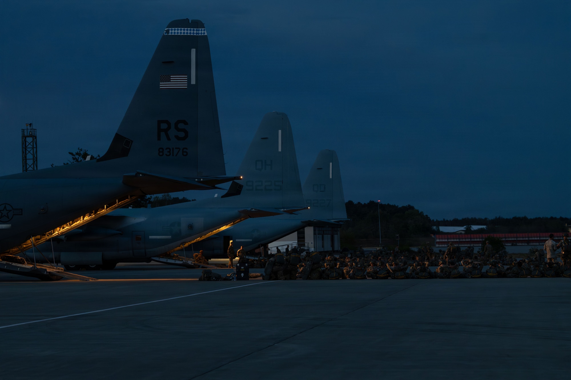 U.S. Army paratroopers assigned to the 173rd Airborne Brigade prepare to load onto a U.S. Air Force C-130J Super Hercules and two U.S. Marine KC-130J Hercules aircraft during Saber Junction 26 at Ramstein Air Base, Germany Aug. 26, 2026.