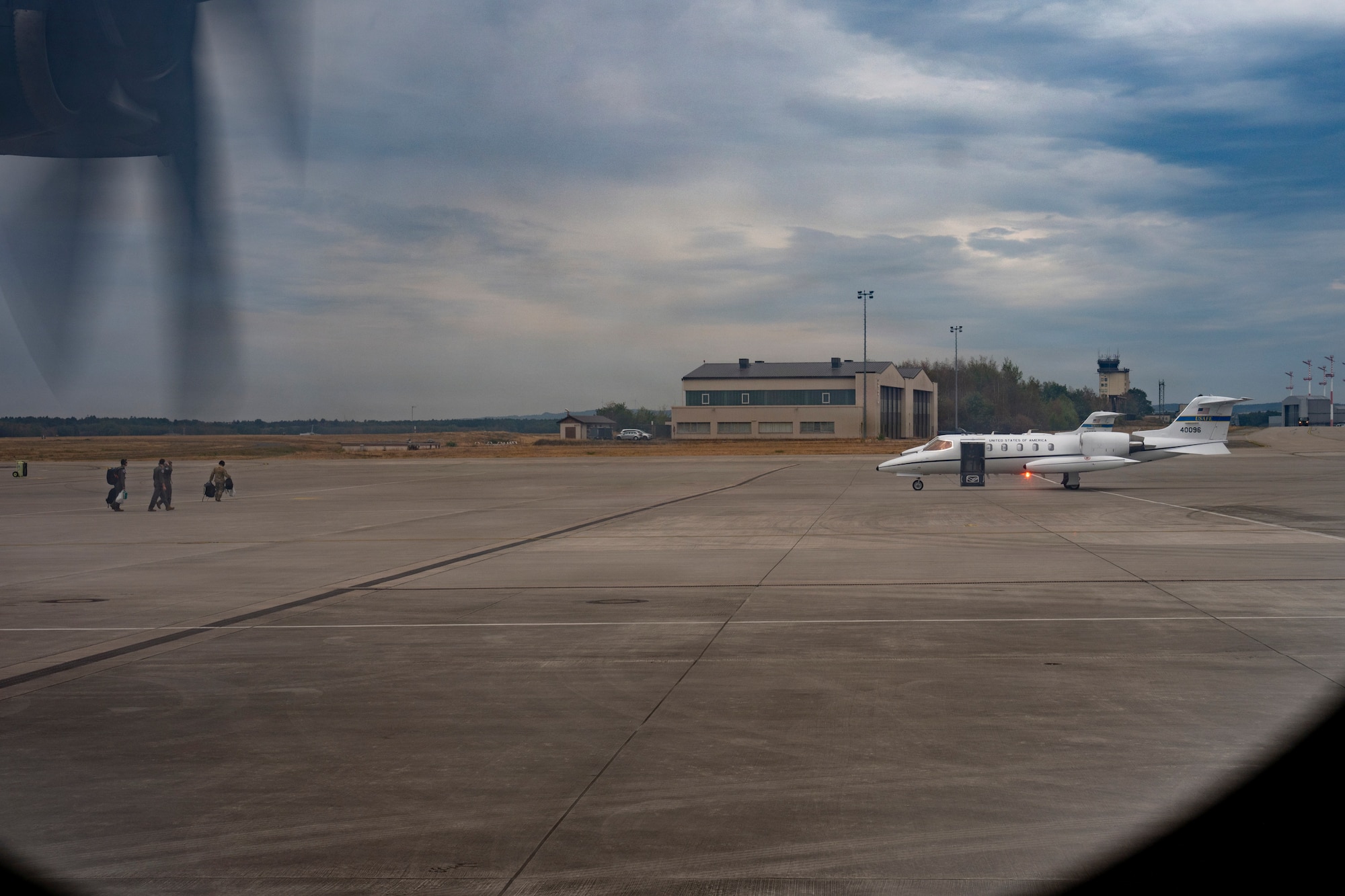 U.S. Air Force 86th Aeromedical Evacuation Squadron Airmen move toward a C-21A Learjet aircraft during exercise Agile Gateway at Ramstein Air Base, Germany, Aug. 24, 2026.
