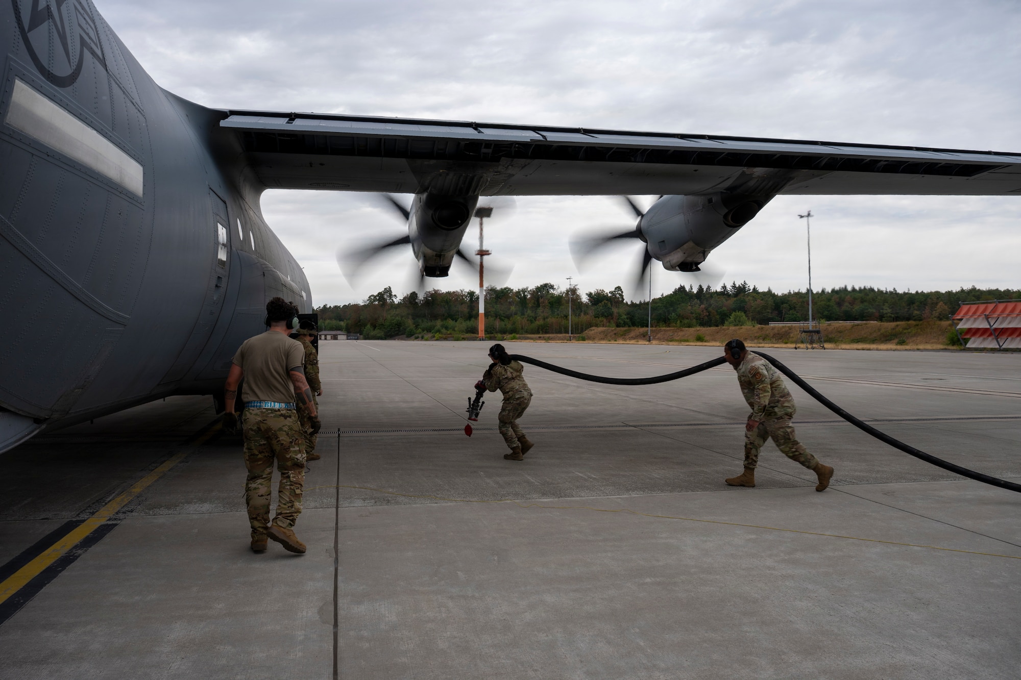 U.S. Air Force Airmen perform hot-pit refueling on a C-130J Super Hercules aircraft during exercise Saber Junction 26 at Ramstein Air Base, Germany, Aug. 24, 2026.