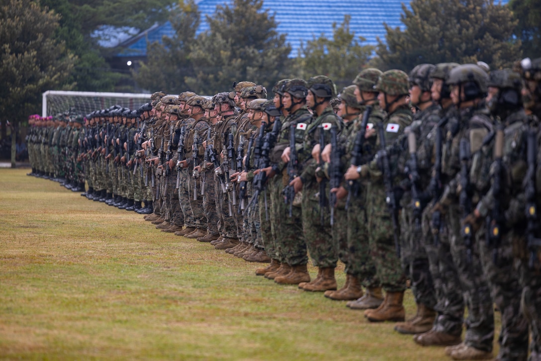 U.S. Marines with Alpha Company, 1st Battalion, 5th Marine Regiment, Marine Rotational Force – Darwin 26, Indonesian marines with 7th Infantry Battalion, 4th Infantry Brigade, Republic of Korea marines with 3rd Reconnaissance Battalion, 6th Marine Brigade, and Japan Ground Self-Defense Force service members with 2nd Amphibious Rapid Deployment Regiment, Amphibious Rapid Deployment Brigade, stand at attention during an opening ceremony for Exercise Super Garuda Shield 26 at the Indonesian Marine Corps 7th Infantry Battalion base near Lampung, Indonesia, Aug. 31, 2026. Super Garuda Shield is an annual exercise between the Indonesian National Armed Forces and U.S. Military designed to strengthen bilateral interoperability, capabilities, and cooperation. (U.S. Marine Corps photo by Sgt. Kyle Chan)