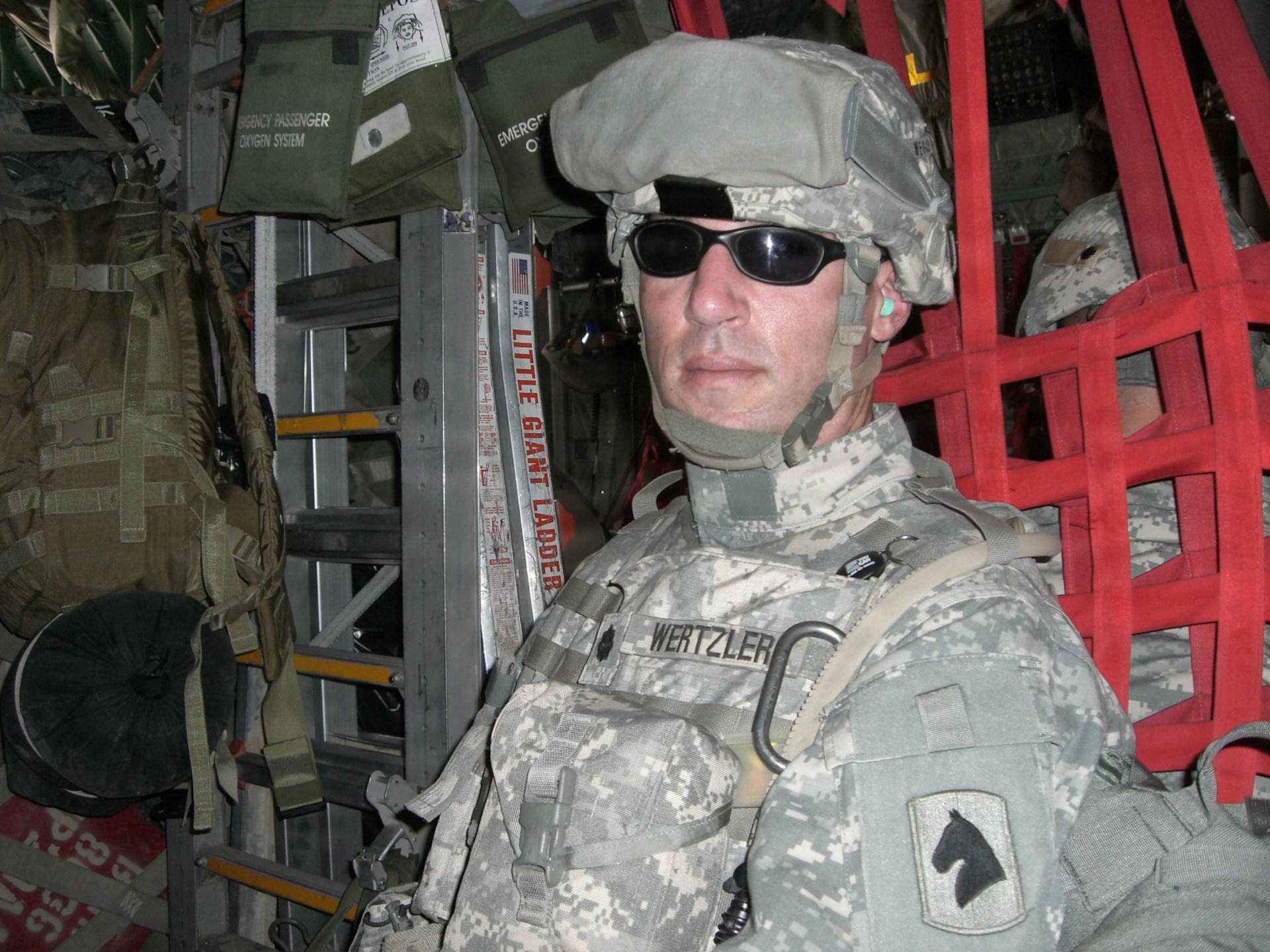 U.S. Army Lt. Col. Brian Wertzler rides in a helicopter while on deployment in Iraq from 2007-2008.
