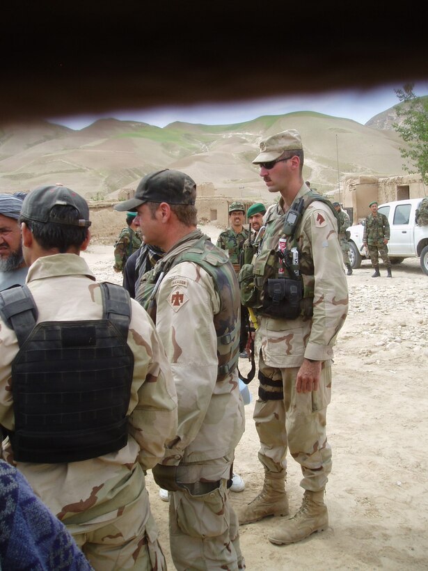 U.S. Army Maj. Brian Wertzler listens while on deployment in Afghanistan in 2004.