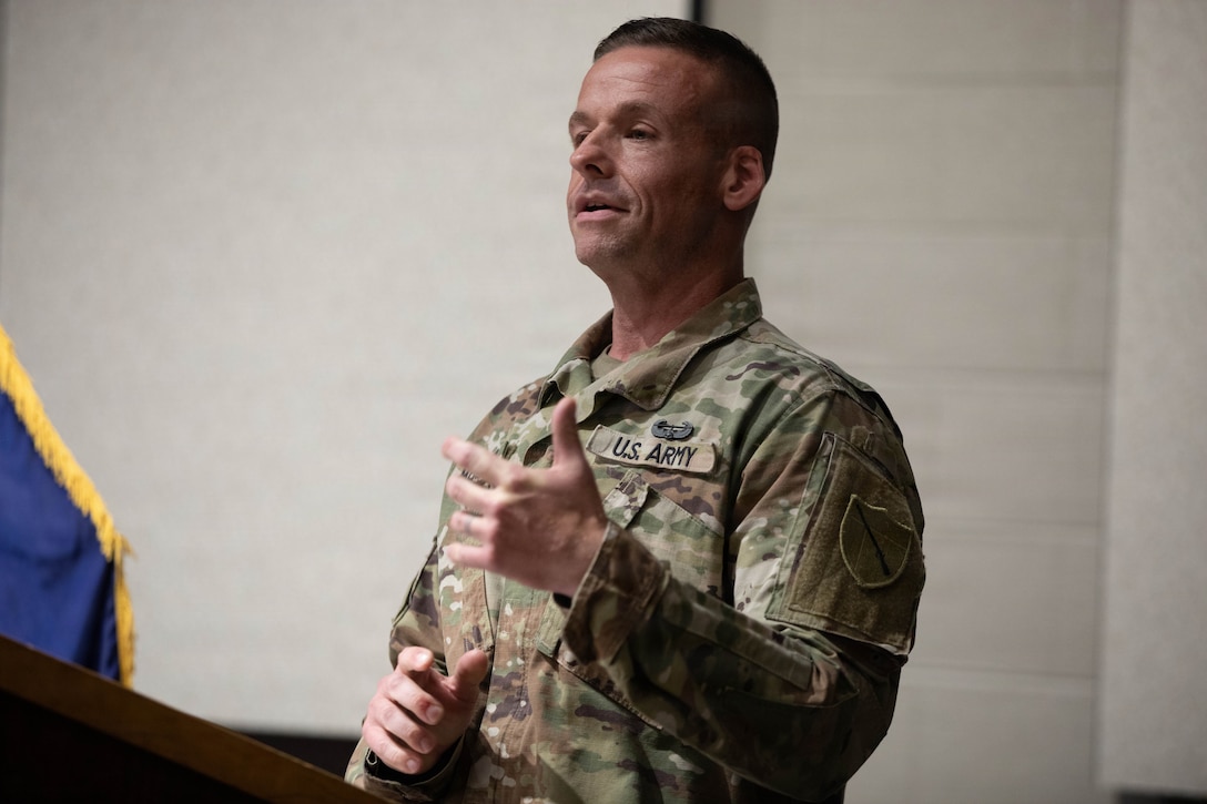 U.S. Army Sgt. Maj. Michael Meredith speaks to family, friends and colleagues during a promotion ceremony at Barker Auditorium at Boone National Guard Center in Frankfort, Kentucky, Aug. 10.