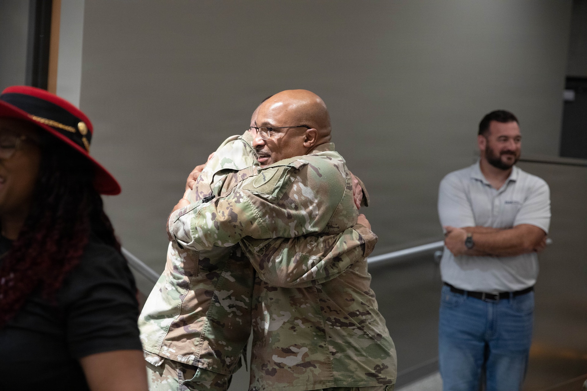 U.S. Army Sgt. Maj. Michael Meredith is congratulated by Sgt. Maj. Darrell Brookins following a promotion ceremony at the Barker Auditorium at Boone National Guard Center in Frankfort, Kentucky, Aug. 10.