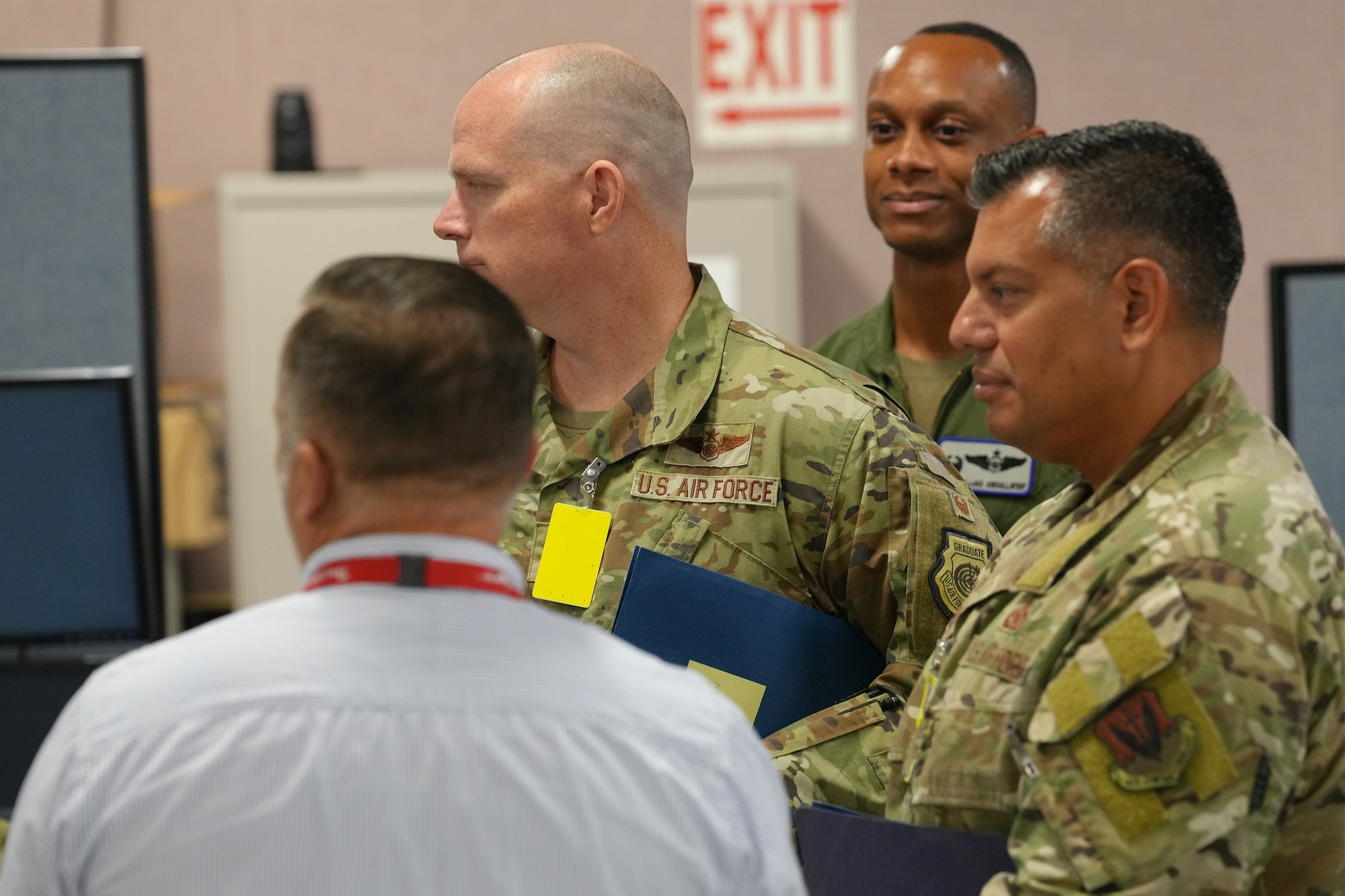 U.S. Airmen listen to briefer
