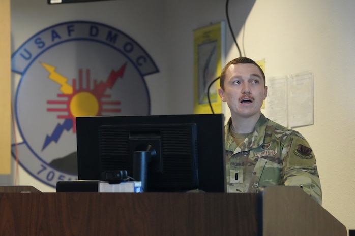 uniformed USAF member briefs