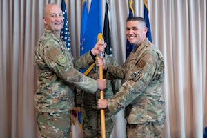 Brig. Gen. Joshua Williams, left, appoints Chief Master Sgt. Brandon Oxton as the Department of the Air Force Portfolio Acquisition Executive for Command, Control, Communications and Battle Management’s senior enlisted leader at the Minuteman Commons, here, Aug 28. C3BM is responsible for managing the DAF Battle Network, which is the integrated system-of-systems connecting sensor, effector, and logistics systems providing better situational awareness, faster operational decisions, and decisive direction to the force. (Official Air Force photo by Richard Blumenstein).