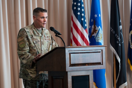 Chief Master Sgt. Brandon Oxton speaks during the Department of the Air Force Portfolio Acquisition Executive for Command, Control, Communications and Battle Management’s change of responsibility ceremony at the Minuteman Commons, here, Aug 28. During the ceremony Oxton assumed the role of C3BM’s senior enlisted leader from Senior Master Sgt. James Sweet. (Official Air Force photo by Richard Blumenstein).