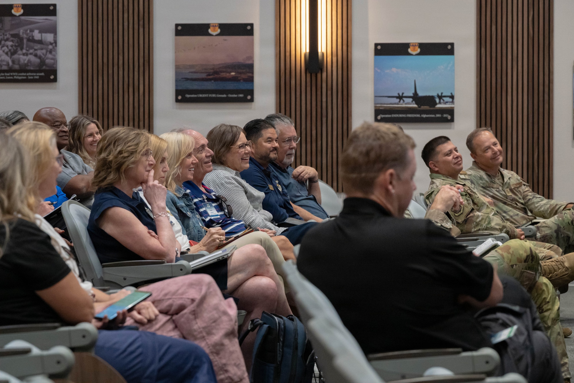 Air Mobility Command civic leaders attend a combined 317th Airlift Wing and 7th Bomb Wing mission brief during an AMC civic leader tour at Dyess Air Force Base, Texas, Aug. 25, 2026. The briefs provided insight into Dyess’ future and the installation’s complementary “Lift and Strike” missions. (U.S. Air Force photo by Airman 1st Class Layla Desch)