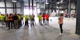 Milestone reached! Laura Emanski, Product Manager Small Caliber Ammunition, thanks the dedicated trade workforce during the dry-in ceremony for the new 6.8mm production facility at Lake City Army Ammunition Plant.