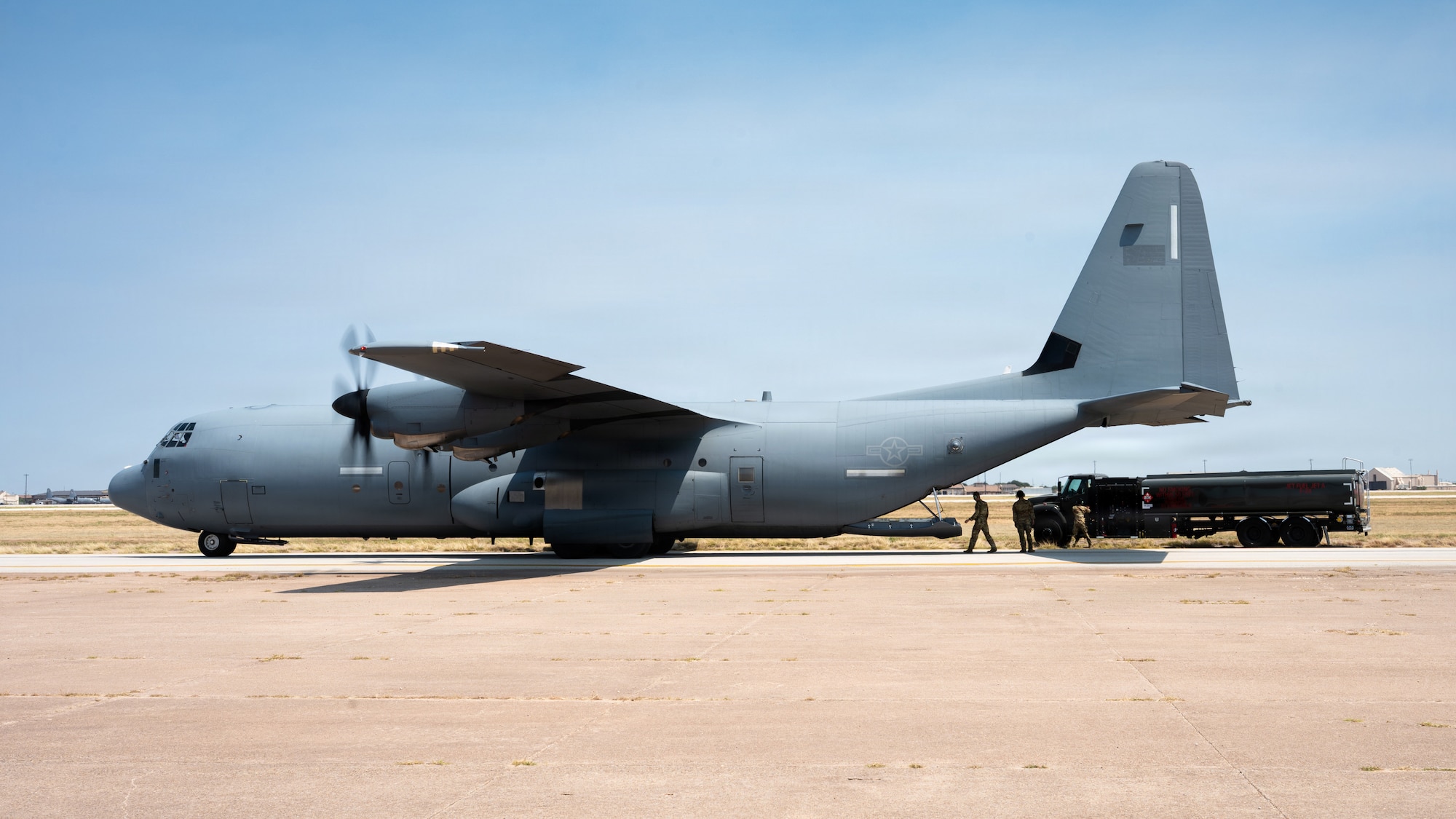 A U.S. Air Force C-130J Super Hercules performs a Specialized Fueling Operation during an Air Mobility Command civic leader tour at Dyess Air Force Base, Texas, Aug. 25, 2026. AMC Civic leaders observed the aircraft simulate transferring fuel to a refueling vehicle, demonstrating how the 317th Airlift Wing can extend logistics support to austere and dispersed locations. (U.S. Air Force photo by Senior Airman Jade M. Caldwell)