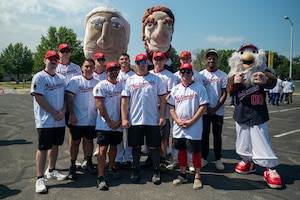 Members representing team Joint Base Anacostia-Bolling pose with Washington Nationals mascots during the 2026 Battle of the Bases Military Softball Tournament at JBAB, Washington, D.C., Aug. 29, 2026. The tournament, hosted by the Nationals, brought local military teams together for friendly competition and camaraderie. (U.S. Air Force photo by Airman 1st Class Arlene Carrara)