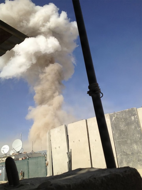 A plume of smoke rises in the air following an attack by insurgents at Forward Operating Base Ghazni, Afghanistan, Aug. 28, 2013.