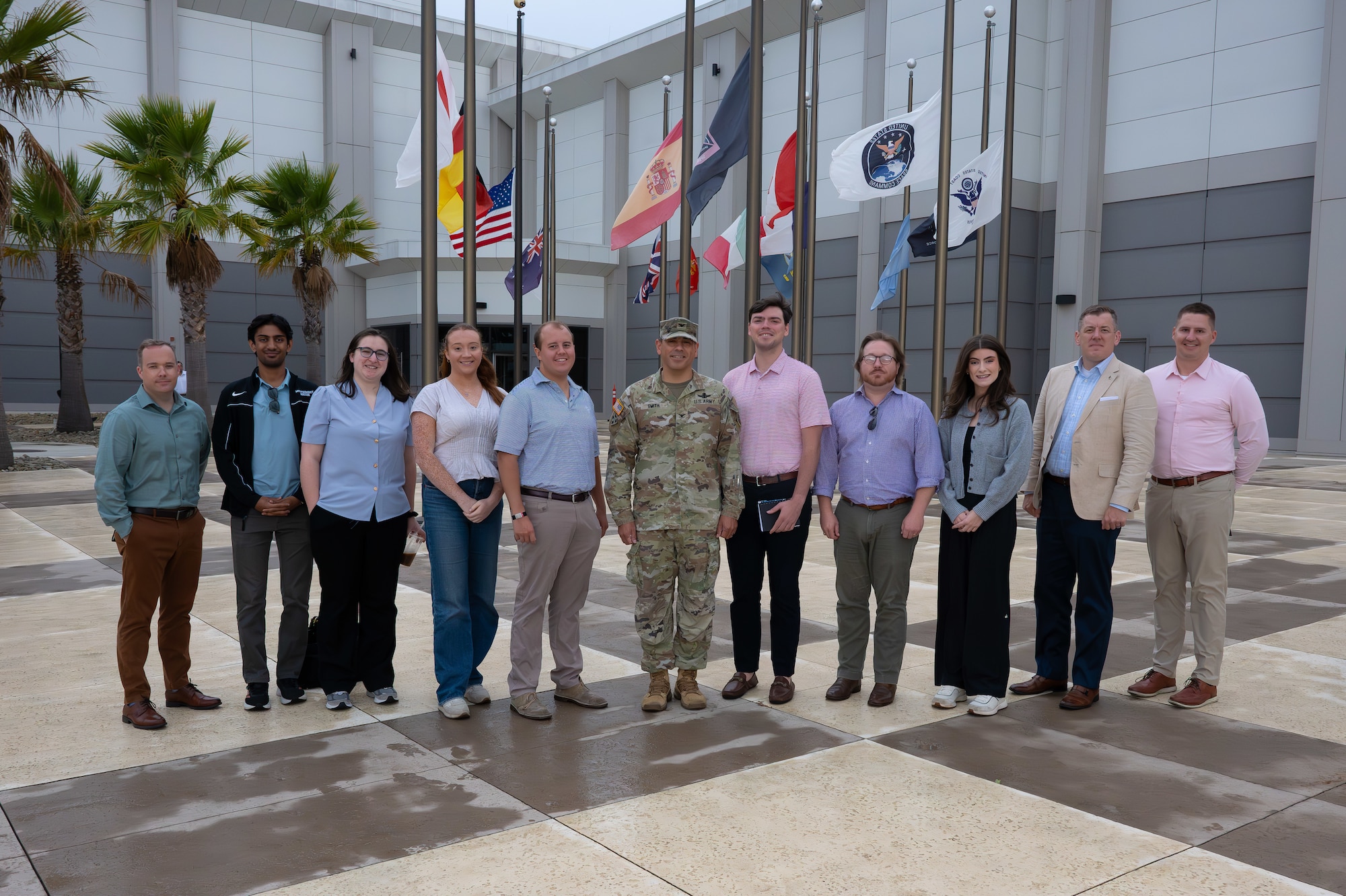 A service member and military service member pose for a photo.