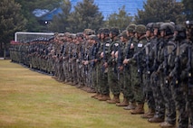 U.S. Marines with Alpha Company, 1st Battalion, 5th Marine Regiment, Marine Rotational Force – Darwin 26, Indonesian marines with 7th Infantry Battalion, 4th Infantry Brigade, Republic of Korea marines with 3rd Reconnaissance Battalion, 6th Marine Brigade, and Japan Ground Self-Defense Force service members with 2nd Amphibious Rapid Deployment Regiment, Amphibious Rapid Deployment Brigade, stand at attention during an opening ceremony for Exercise Super Garuda Shield 26 at the Indonesian Marine Corps 7th Infantry Battalion base near Lampung, Indonesia, Aug. 31, 2026. Super Garuda Shield is an annual exercise between the Indonesian National Armed Forces and U.S. Military designed to strengthen bilateral interoperability, capabilities, and cooperation. (U.S. Marine Corps photo by Sgt. Kyle Chan)