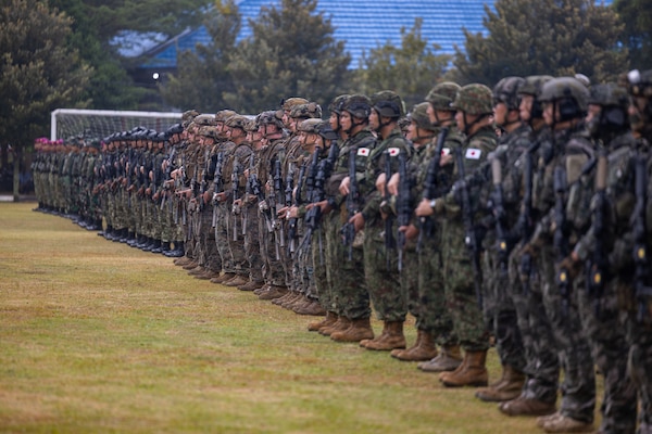 U.S. Marines with Alpha Company, 1st Battalion, 5th Marine Regiment, Marine Rotational Force – Darwin 26, Indonesian marines with 7th Infantry Battalion, 4th Infantry Brigade, Republic of Korea marines with 3rd Reconnaissance Battalion, 6th Marine Brigade, and Japan Ground Self-Defense Force service members with 2nd Amphibious Rapid Deployment Regiment, Amphibious Rapid Deployment Brigade, stand at attention during an opening ceremony for Exercise Super Garuda Shield 26 at the Indonesian Marine Corps 7th Infantry Battalion base near Lampung, Indonesia, Aug. 31, 2026. Super Garuda Shield is an annual exercise between the Indonesian National Armed Forces and U.S. Military designed to strengthen bilateral interoperability, capabilities, and cooperation. (U.S. Marine Corps photo by Sgt. Kyle Chan)