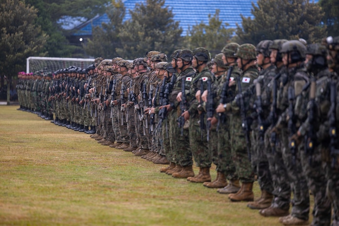 U.S. Marines with Alpha Company, 1st Battalion, 5th Marine Regiment, Marine Rotational Force – Darwin 26, Indonesian marines with 7th Infantry Battalion, 4th Infantry Brigade, Republic of Korea marines with 3rd Reconnaissance Battalion, 6th Marine Brigade, and Japan Ground Self-Defense Force service members with 2nd Amphibious Rapid Deployment Regiment, Amphibious Rapid Deployment Brigade, stand at attention during an opening ceremony for Exercise Super Garuda Shield 26 at the Indonesian Marine Corps 7th Infantry Battalion base near Lampung, Indonesia, Aug. 31, 2026. Super Garuda Shield is an annual exercise between the Indonesian National Armed Forces and U.S. Military designed to strengthen bilateral interoperability, capabilities, and cooperation. (U.S. Marine Corps photo by Sgt. Kyle Chan)