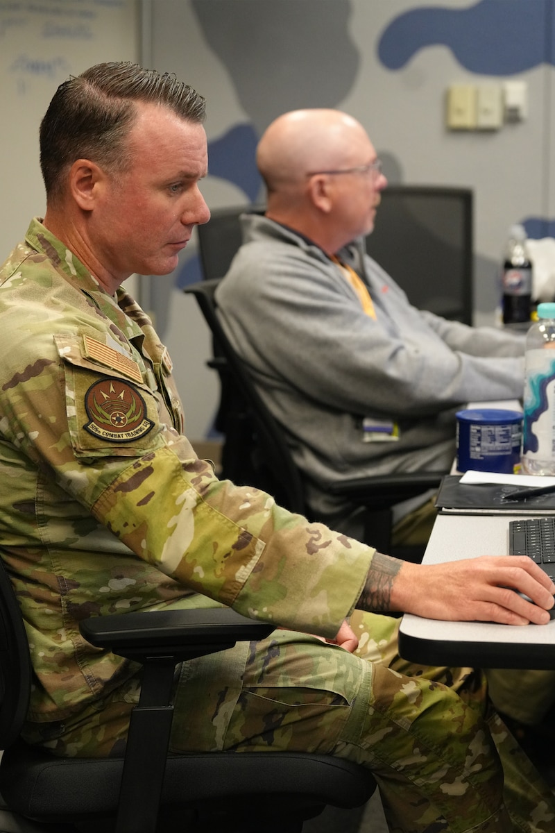 U.S. Air Force warfighters work on computers