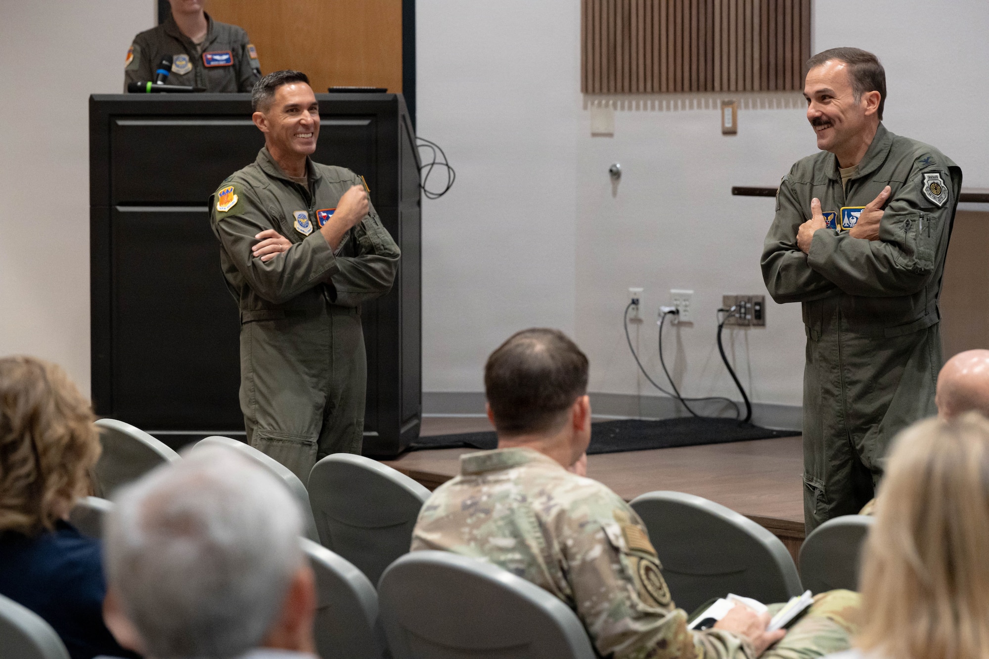 U.S. Air Force Col. Robert Sturgill Jr., 7th Bomb Wing and installation commander, and Col. Christopher Welch, 317th Airlift Wing commander, brief Air Mobility Command civic leaders at Dyess Air Force Base, Texas, Aug. 25, 2026. The commanders highlighted how the installation’s long-range strike and tactical airlift missions work together to contribute to America’s unrivaled global reach and combat airpower. (U.S. Air Force photo by Airman 1st Class Layla Desch)