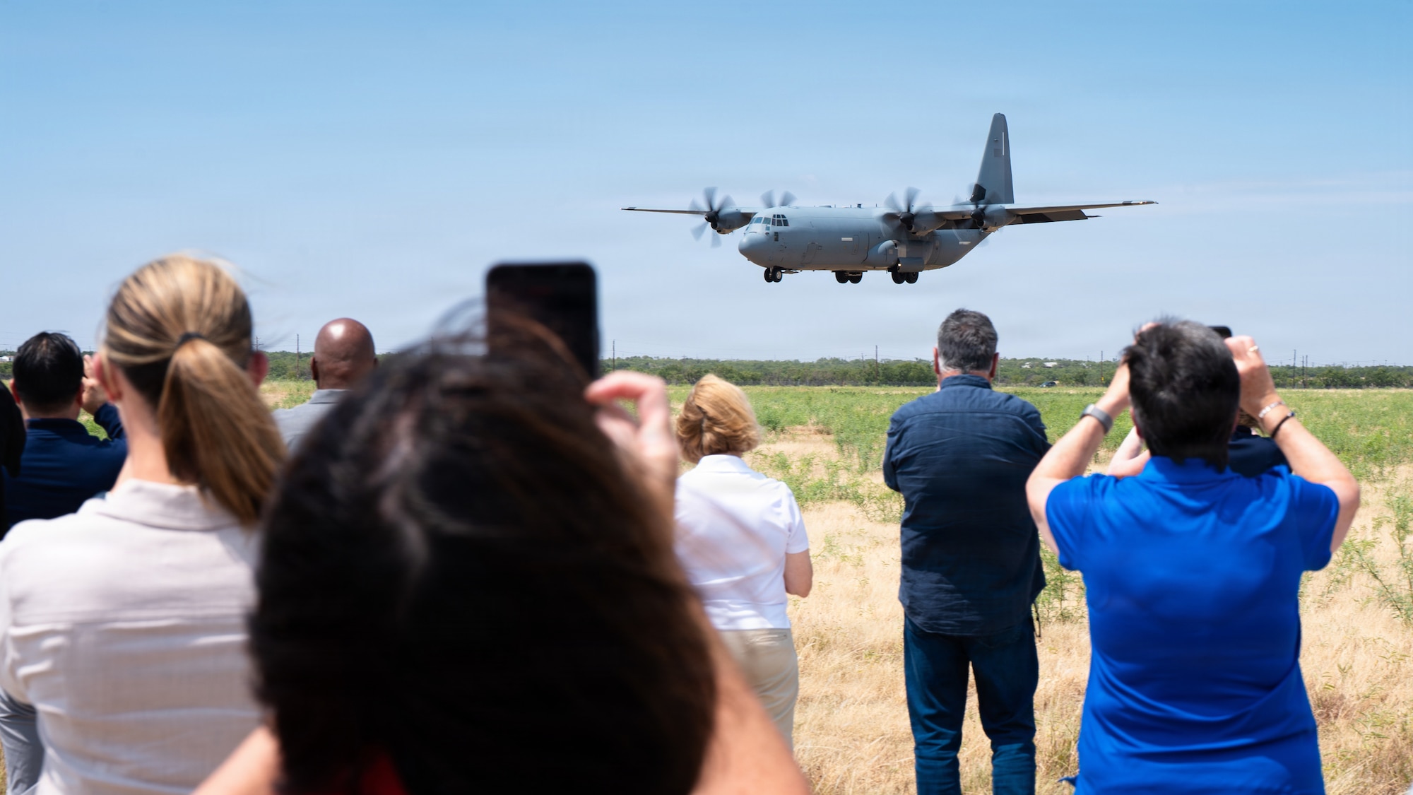 Air Mobility Command civic leaders watch a U.S. Air Force C-130J Super Hercules perform a Maximum-Effort Landing during a tour at Dyess Air Force Base, Texas, Aug. 25, 2026. The demonstration highlighted the aircraft’s ability to operate on short runways, a capability that enables the 317th Airlift Wing to deliver personnel and cargo in austere environments. (U.S. Air Force photo by Senior Airman Jade M. Caldwell)