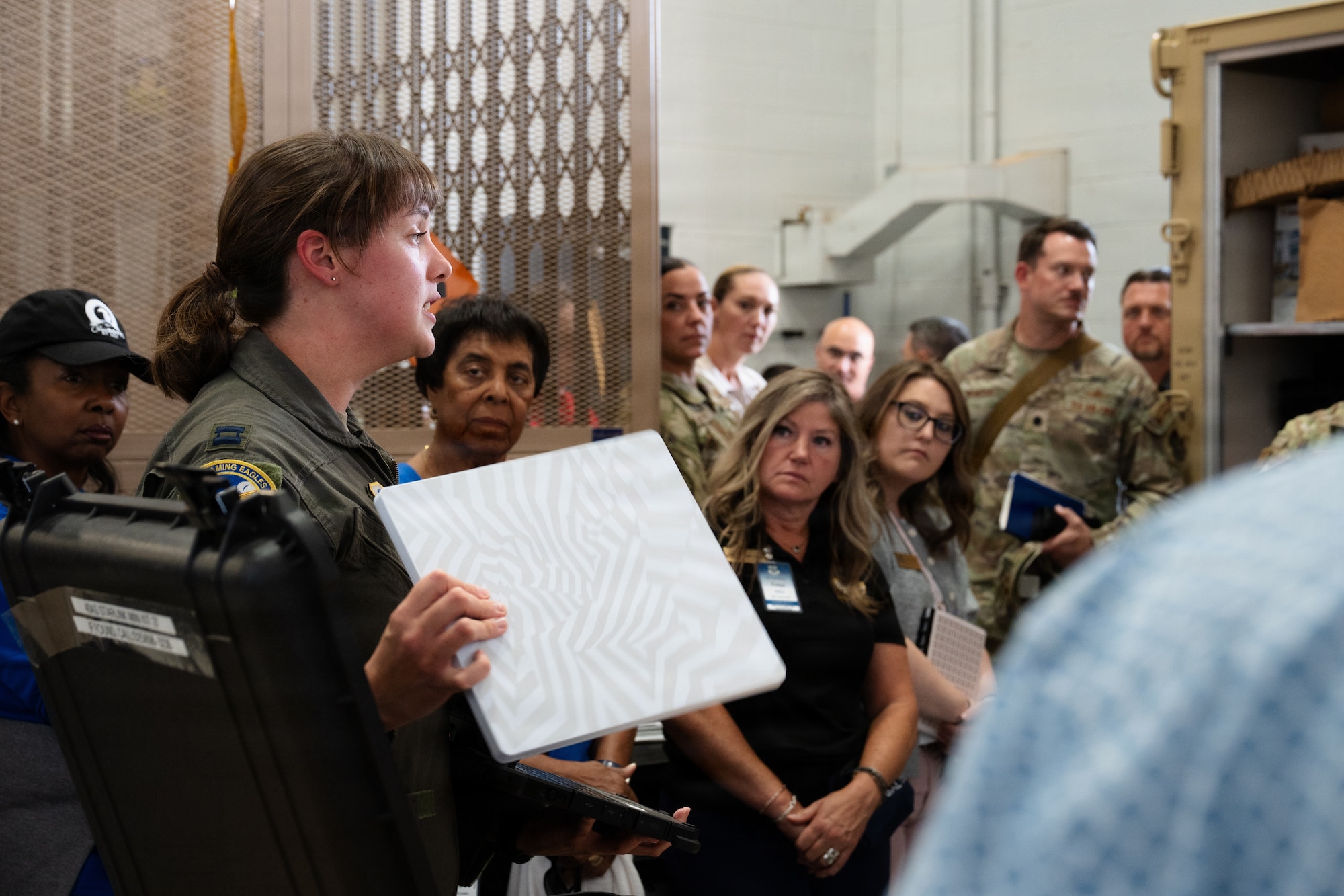 U.S. Air Force Capt. Nicole Baird, 40th Airlift Squadron pilot, explains the capabilities of a mobile Tactical Operations Center to Air Mobility Command civic leaders during a tour at Dyess Air Force Base, Texas, Aug. 25, 2026. The “TOC-in-a-Box” demonstration provided civic leaders firsthand insight into how the 317th Airlift Wing establishes mission-planning and command-and-control capabilities in expeditionary environments at a moment’s notice. (U.S. Air Force photo by Senior Airman Jade M. Caldwell)