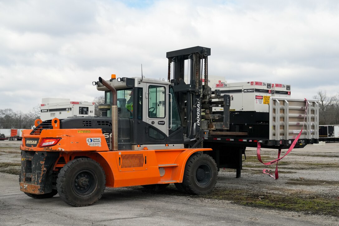 a forklift moves a generator