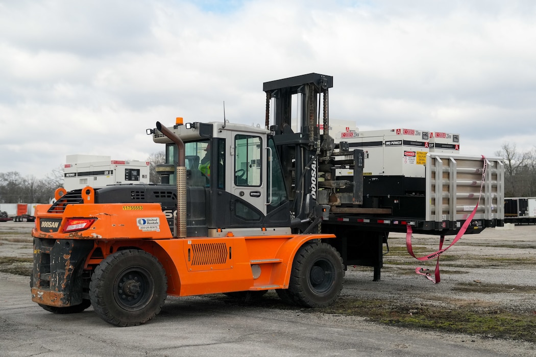 a forklift moves a generator