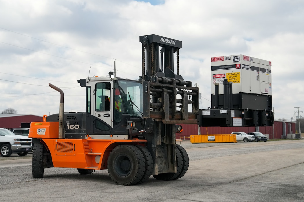 a forklift moves a generator