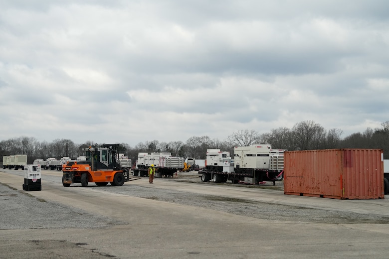 Generators are staged on flatbeds
