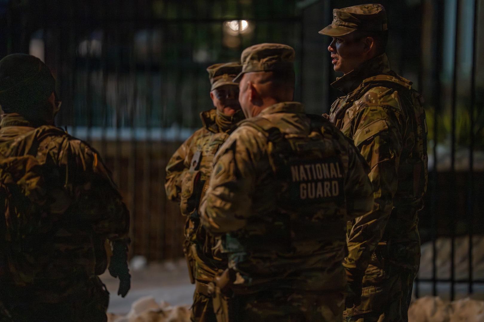 U.S. Army Col. Larry Doane, commander of Joint Task Force–D.C., speaks with Soldiers during a nighttime presence patrol in Washington, D.C., Jan. 30, 2026, in support of the D.C. Safe and Beautiful mission. Doane conducted on-the-ground assessments to evaluate mission execution and reinforce command presence across assigned sectors. (U.S. Air National Guard photo by Master Sgt. William Blankenship)