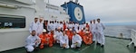 The crews of the Seaways Kenosha and La Pena pose for a photo on the Seaways Kenosha